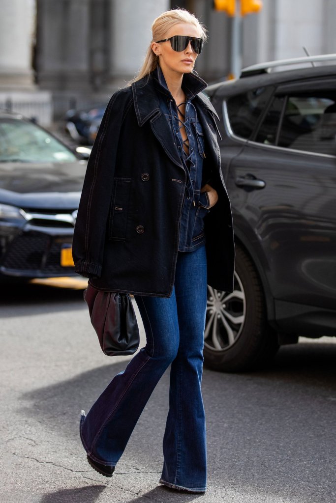 Girl in blue denim jeans, matching shirt and denim coat.